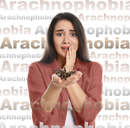 Scared woman with tarantula on white background. Arachnophobia (fear of spiders)