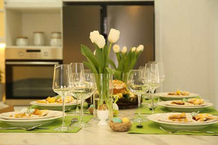 Festive Easter table setting with floral decor in kitchen