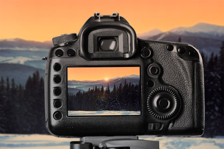 Recording beautiful view of mountain landscape on professional video camera
