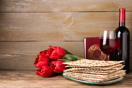 Composition with Passover matzos on wooden table, space for text. Pesach celebration