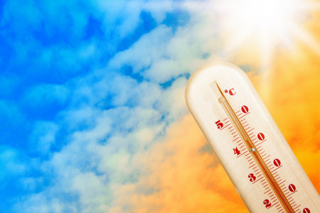 Weather thermometer with high temperature and color sky on background, space for text
