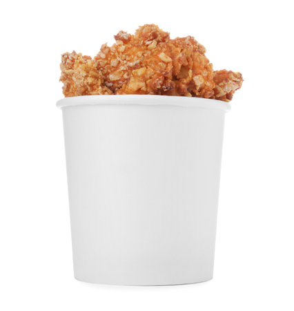 Bucket with yummy fried nuggets isolated on whiteの写真素材