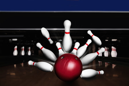Bowling ball bouncing pins. Successful hit-strike