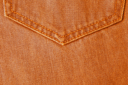 Texture of orange jeans as background, closeupの写真素材