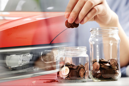 Buying car. Double exposure of auto and woman putting coins into jarの写真素材
