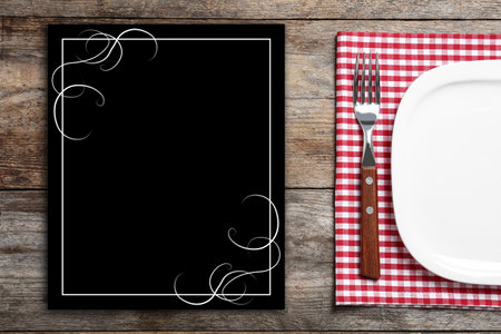 Stylish elegant table setting and empty menu on wooden background, top view. Space for textの写真素材