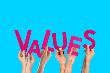 People making word VALUES of letters on blue backgroundの写真素材