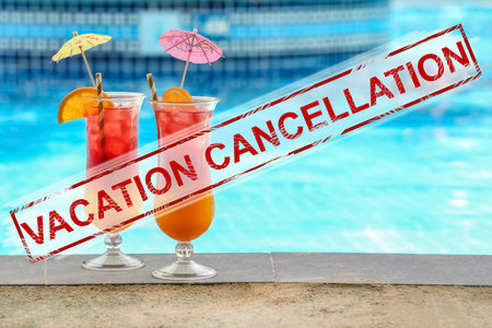 Vacation concept cancellation. Glasses with tasty cocktails near swimming poolの写真素材