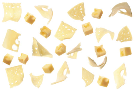 Collage with pieces of cheese falling on white backgroundの写真素材