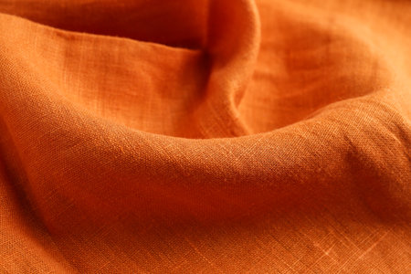Texture of beautiful orange fabric as background, closeupの写真素材