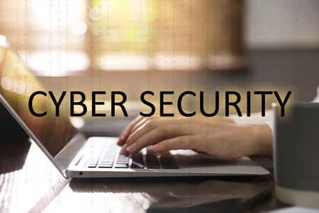 Cyber security concept. Woman working with laptop at table indoors, closeup