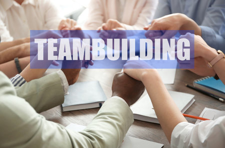 core values concept. People holding hands together at table, closeupの写真素材