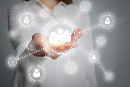 Woman demonstrating virtual structure of organization, focus on hand. business corporationの写真素材
