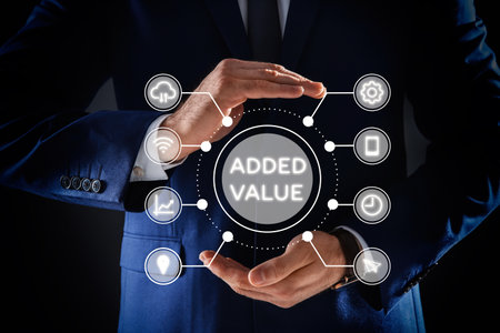 Businessman demonstrating directions of added values on black background, closeupの写真素材