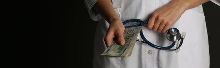 Doctor with bribe and stethoscope on black background, closeup. banner design
