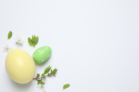 Flat lay composition with Easter eggs on white background. Space for textの写真素材