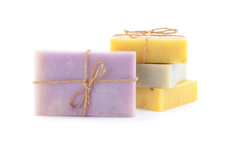 Different bars of organic handmade soap isolated on whiteの写真素材