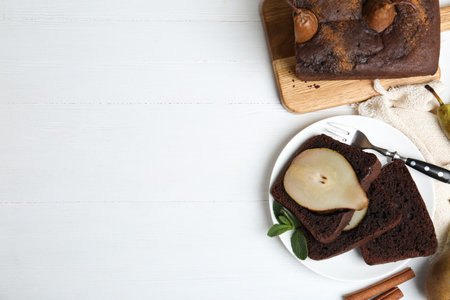 Flat lay composition with tasty pear bread on white wooden table, space for text. homemade cakeの写真素材