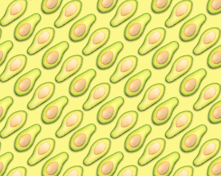 Pattern of avocado halves on pale yellow background