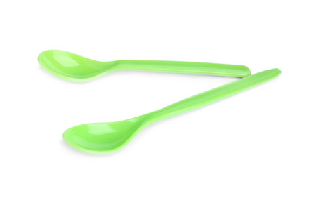 Small plastic spoons isolated on white. Serving baby foodの写真素材