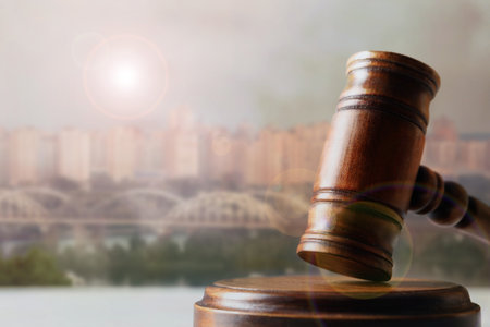 Judge's gavel against beautiful cityscape, closeup. Space for textの写真素材