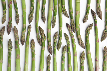 Fresh raw asparagus on white background, top viewの写真素材