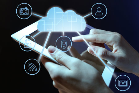 cloud technology. Woman using tablet on dark background, closeup