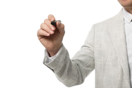 Businessman with marker on white background, closeupの写真素材