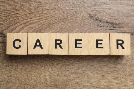 Cubes with word CAREER on wooden background, flat layの写真素材