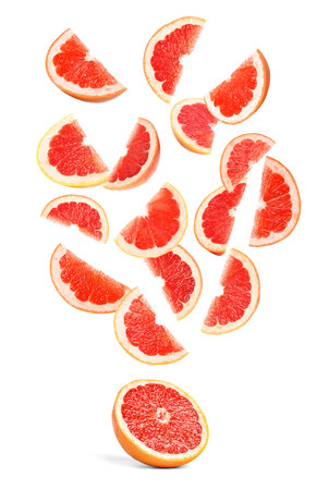 Slices of juicy grapefruit on white backgroundの写真素材