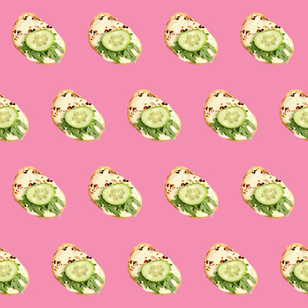 Set of delicious toasted bread with spread, cucumber and arugula on pink background, top viewの写真素材