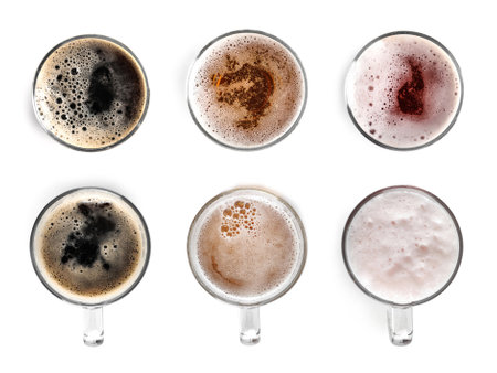 Set with glasses of cold tasty beer on white background, top viewの写真素材