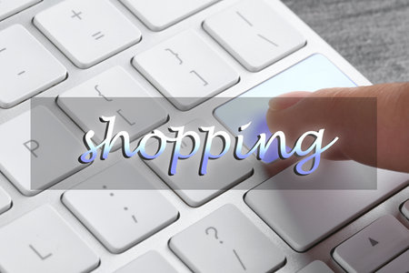 Woman pressing button on computer keyboard, closeup. internet shopping