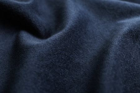 Texture of dark blue fabric as background, closeup