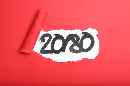 Numbers 20 and 80 on white background, view through hole in red paper. Pareto principle concept