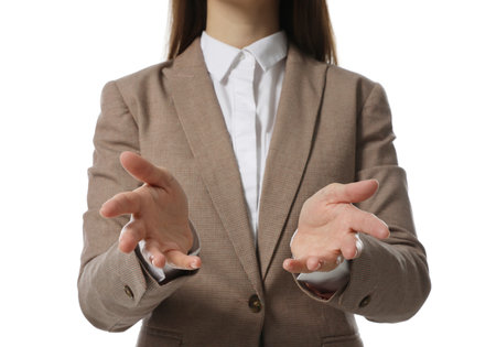 Businesswoman holding something on white background, closeupの写真素材