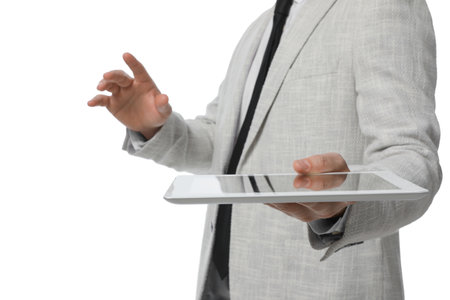 Businessman holding tablet computer on white background, closeupの写真素材