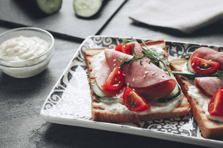 Tasty sandwiches with ham served on gray table, closeup. food photographyの写真素材