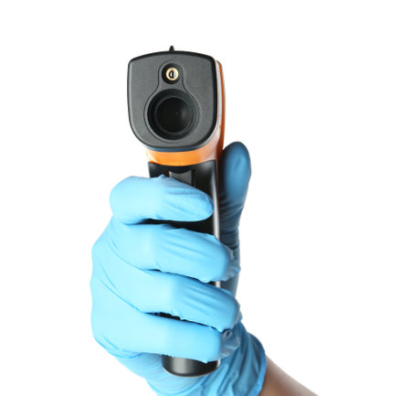 Doctor in latex gloves holding non-contact infrared thermometer on white background, closeup