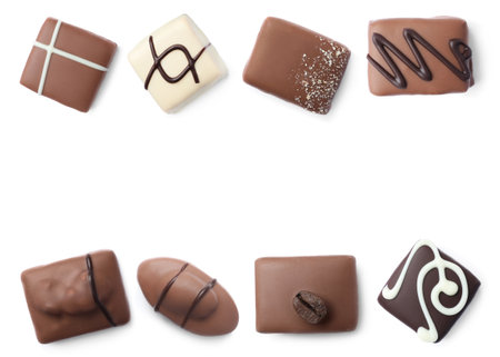 Set with different chocolate candies on white background, top viewの写真素材