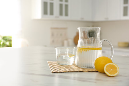 Fresh lemonade on white marble table in kitchenの写真素材