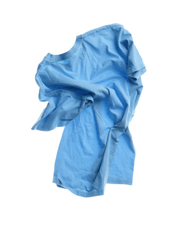 Rumpled light blue t-shirt isolated on whiteの写真素材