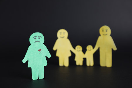 human paper figures on black background. concept of jealousyの写真素材