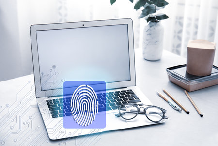 fingerprint identification. Modern laptop on table indoorsの写真素材