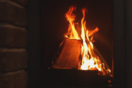 Fireplace with burning wood, closeup view. winter holidaysの写真素材