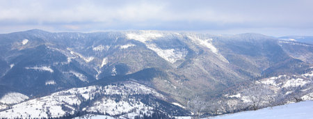 Picturesque view of snowy hills at mountain resort. Banner design