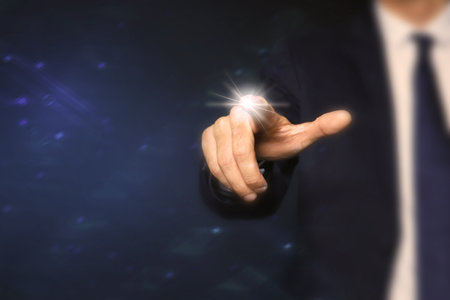 Man pressing button on virtual screen, closeupの写真素材