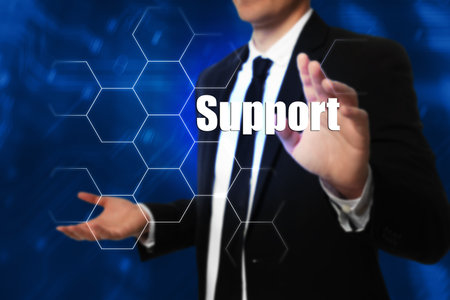 Young businessman near virtual screen, closeup. technical support service