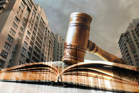law protection. Double exposure of book with gavel and cityscape