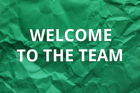 Crumpled paper with phrase Welcome to the teamの写真素材